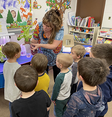 Pre-K student with logo robotic